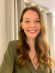 Community member, Hannah, lady with long red hair, smiling
